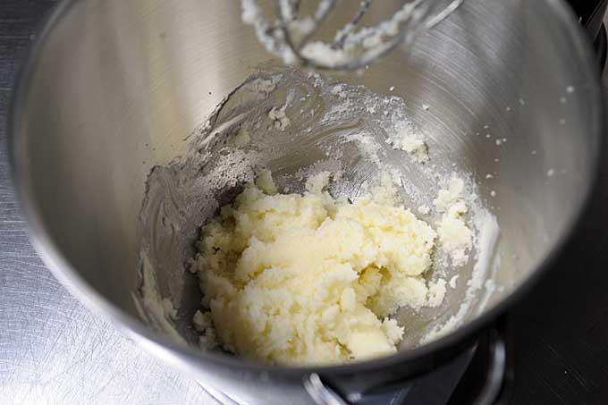 Sugar and butter being mixed together by a stand mixer | Foodal