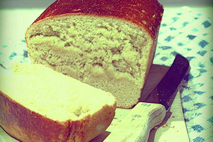 Close up a loaf of artisan white bread | Foodal