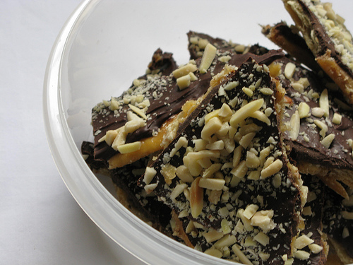 A ceramic bowl full of Almond Chocolate Toffee Crunchies | Foodal