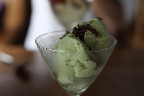An image of creamy scoops of delicious pistachio ice cream.