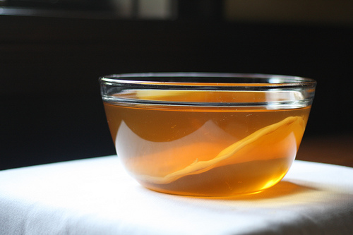 An image of a glass bowl filled with tea mixture. 