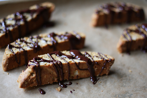 An image of chocolate drizzled anise biscotti.