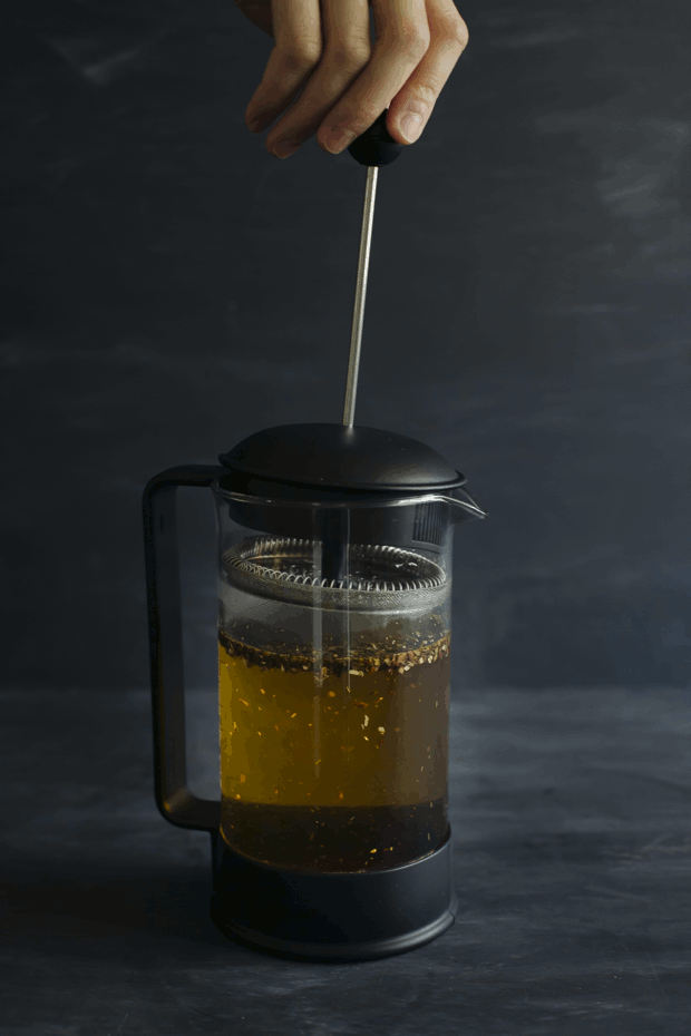 Animated photos of a French press being used to brew Rooibos tea | Foodal