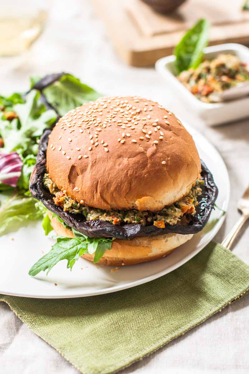 Semi-oblique view of a vegan-friendly burger made with a portobello mushroom.