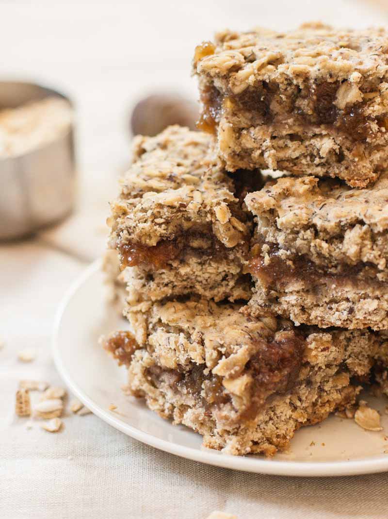 Close up of stack of breakfast cookie bars made with figs, oats, oat-flour, and flax seed.