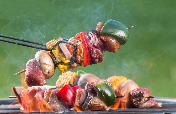 Meat and vegetable kabobs on the grill