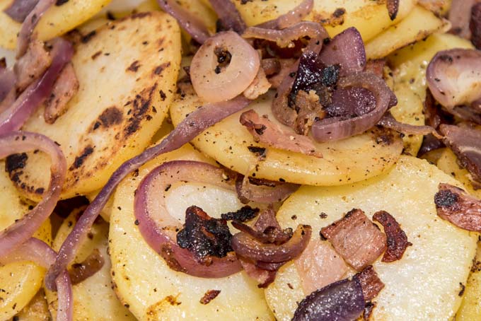 oven fried or roasted potatoes in in white bowl