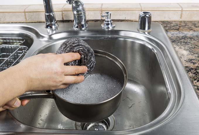 Go easy with stainless steel scrub pads - for use on clad or stainless steel cooking vessels only | Foodal.com