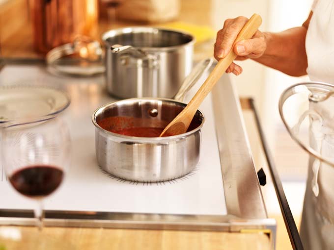 Stiring with wooden, silicon, or plastic utensils helps to protect the surface of your cookware | Foodal.com