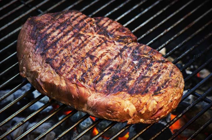 Searing a steak on the grill | Foodal.com