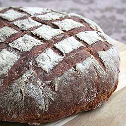 Freshly baked dark rye malted bread loaf. | Foodal.com