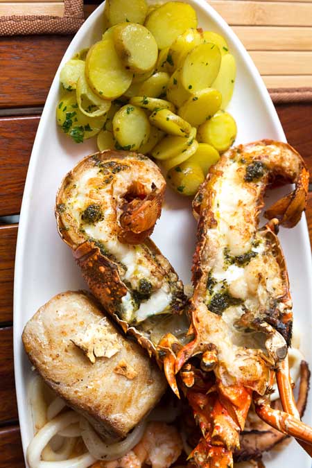Grilled Lobster Tails with Herbed Butter and Baby Potatoes Recipe | Foodal.com