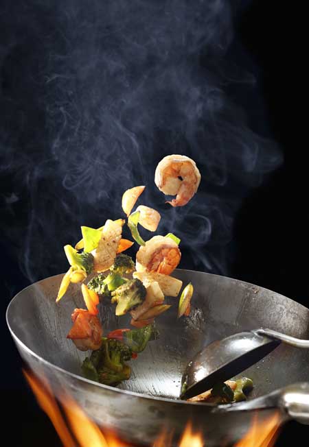 The ability to "toss" while stir frying is a great cross-cultural culinary skill to develop, and it can bring your food preparation to a whole new level - plus, it looks cool! Read more at https://foodal.com/kitchen/pots-pots-skillets-guides-reviews/guides/how-to-use-a-wok-for-stir-frying-and-steaming/