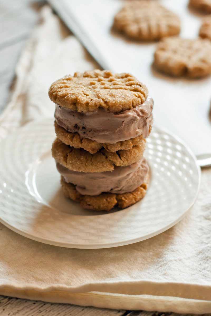 A stack of vegan peanut butter cookies made into ice cream sandwiches 
