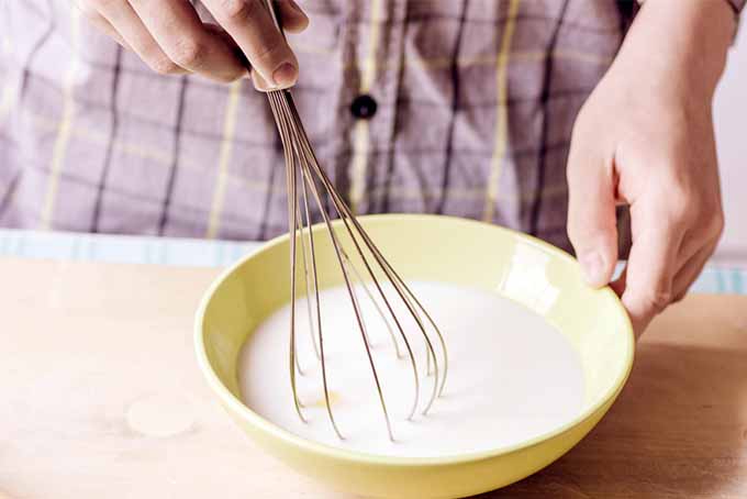 Stirring Whisk in Yellow Bowl | Foodal.com