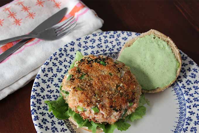 Plated Salmon Burger with Green Goddess Dressing | Foodal.com