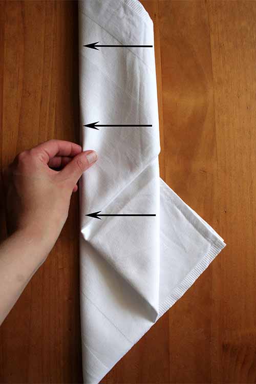 Learn the miter fold and other napkin folding techniques to wow your guests. Read more now on Foodal: https://foodal.com/knowledge/how-to/napkin-folding/