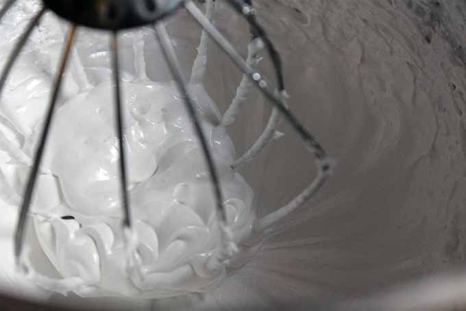 Making meringue using aquafaba which is a solution of reduced chickpea water.