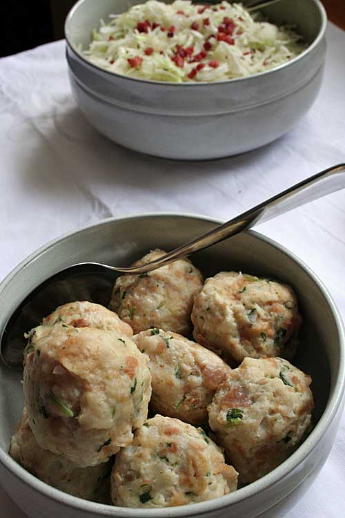 Use up your old bread with this German Bread Dumpling recipe. Add some onions, eggs, milk and parsley and you can create and tasty treat in minutes! Get the recipe now! https://foodal.com/holidays/oktoberfest/german-bread-dumplings/