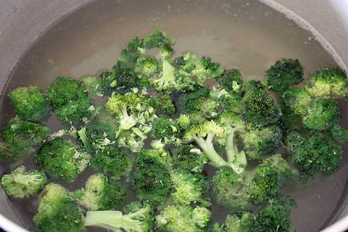 Boil the broccoli florets until al dente | Foodal.com