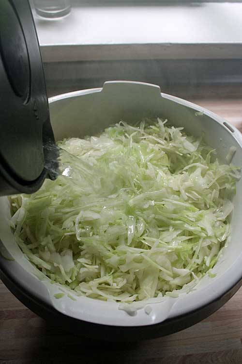 Step 2 of the Bavarian Cabbage Salad Recipe - Pouring over the water | Foodal.com