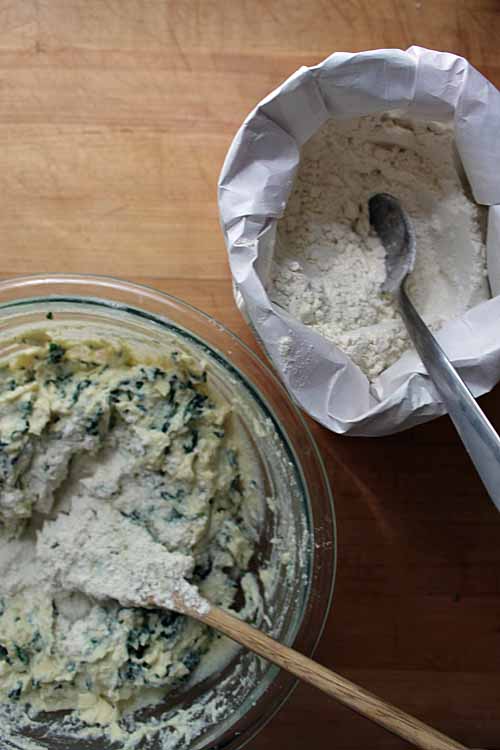 Adding the flour to the Malfatti pasta dough recipe
