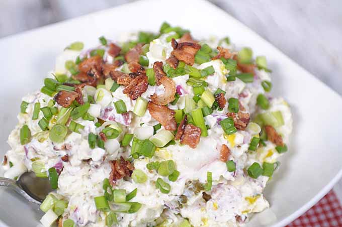 Loaded potato salad with feta cheese, bacon, and sour cream
