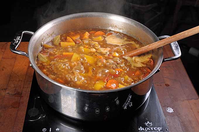 Simmering the stew in a stock pot