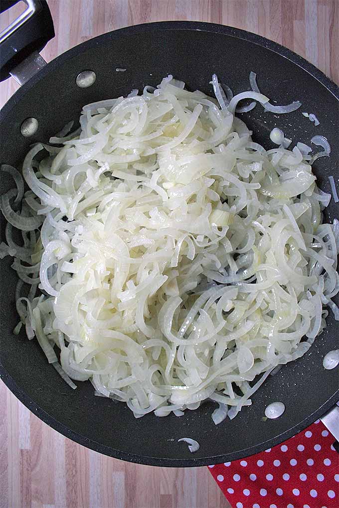 Sautee onions and bacon to make the filling for our German-Style Onion Tart. Get the recipe now: https://foodal.com/recipes/comfort-food/german-onion-tart/