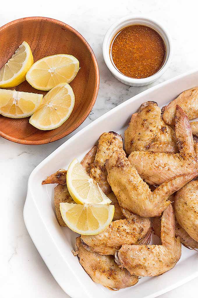 Make a batch of delectable Moroccan lemon wings for game day- they're sure to please a crowd! We share the recipe: https://foodal.com/recipes/poultry/moroccan-lemon-wings/