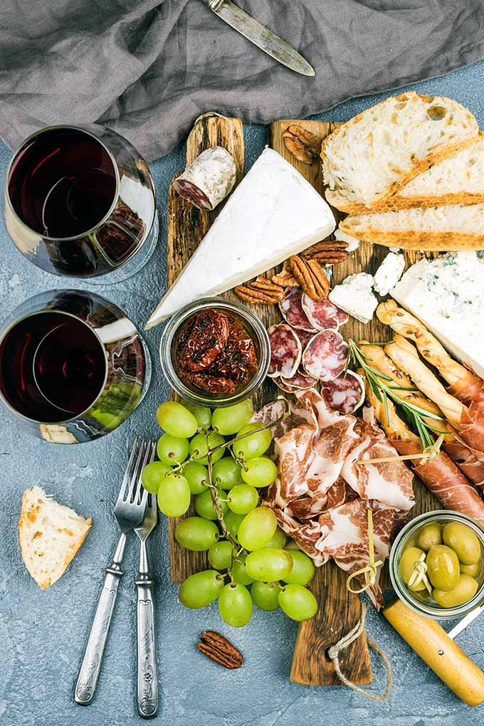 Not sure how to plan the perfect spread of charcuterie and cheese for your holiday spread? Our tips will help! Read more: https://foodal.com/recipes/appetizers/create-perfect-meat-cheese-board/