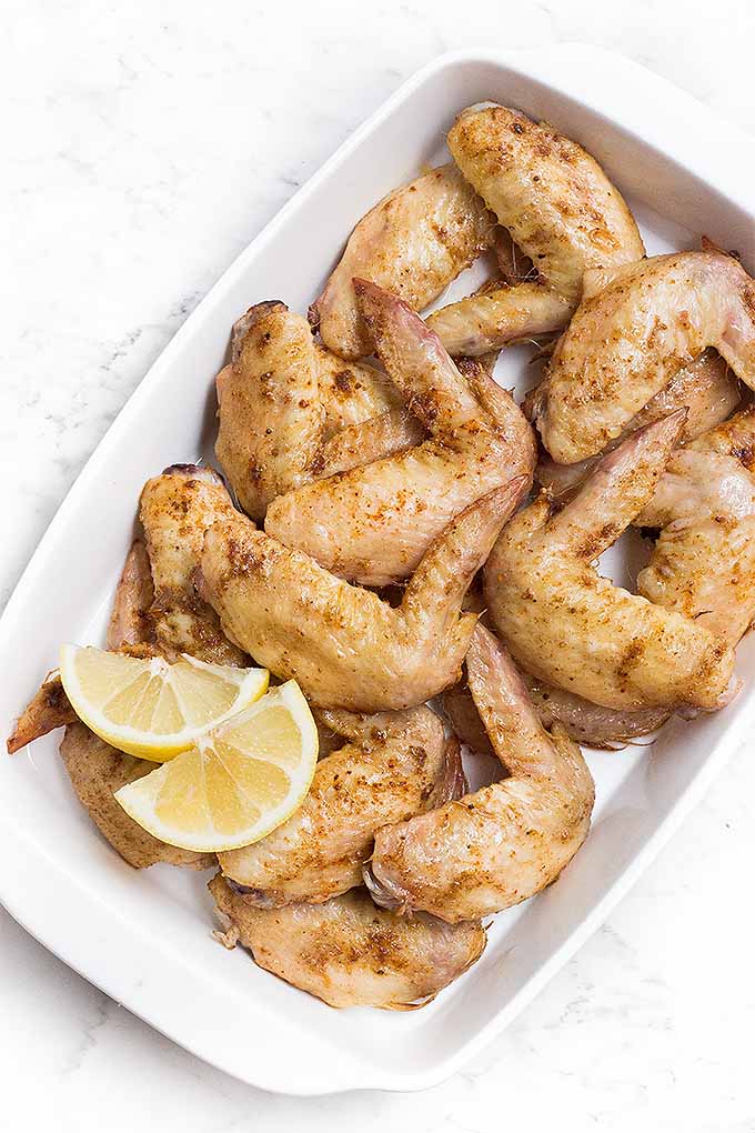 These Moroccan lemon wings are absolutely irresistible, whether grilled or baked in the oven. Just marinade, bake, and serve! Follow the link for the recipe: https://foodal.com/recipes/poultry/moroccan-lemon-wings/