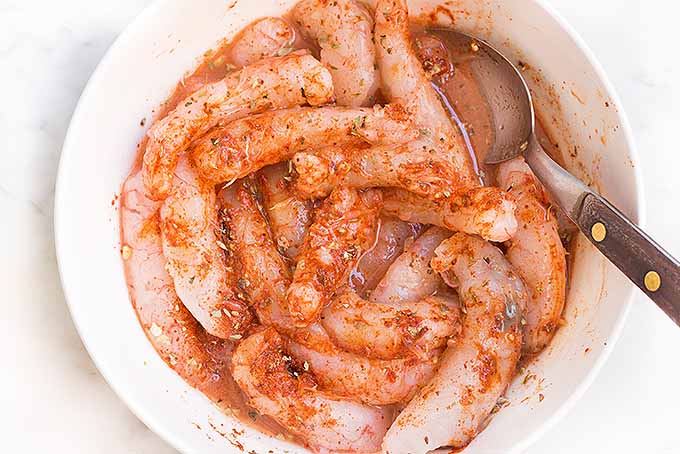 Soak shrimp in a spicy marinade to make delicious sizzling fajitas at home. | Foodal.com