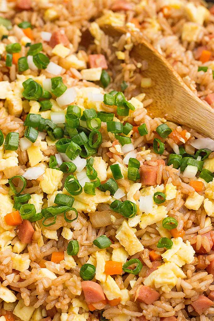 This easy fried rice recipe is so comforting and delicious- way better than takeout, made with fresh veggies. Get the recipe now or Pin It for later: https://foodal.com/recipes/chinese/easy-sausage-fried-rice/