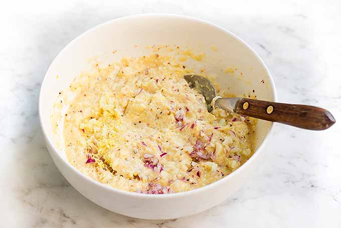 Stir together a rich and buttery breadcrumb mixture to stuff and top homemade baked shrimp scampi.