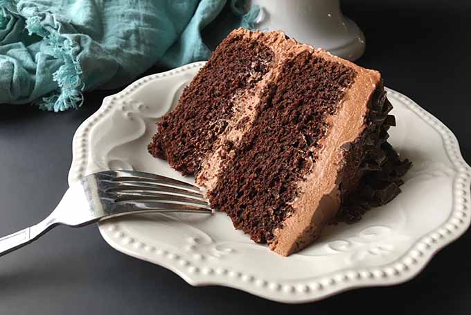 A slice of freshly made chocolate cake | Foodal.com