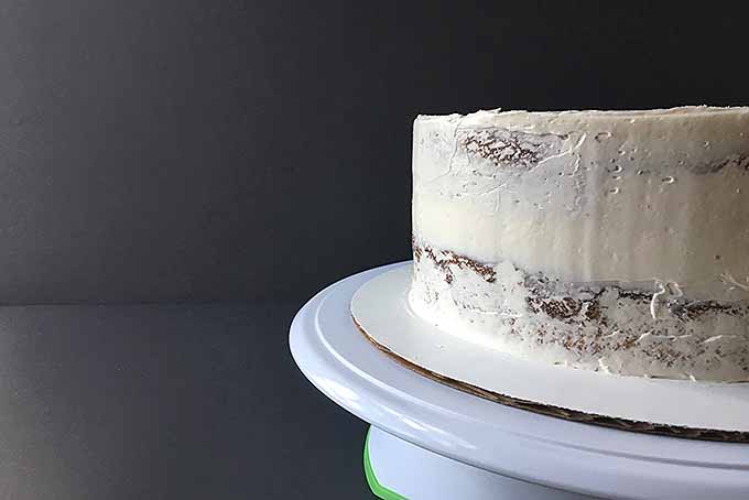 Crumb coating on a two-layer cake | Foodal.com