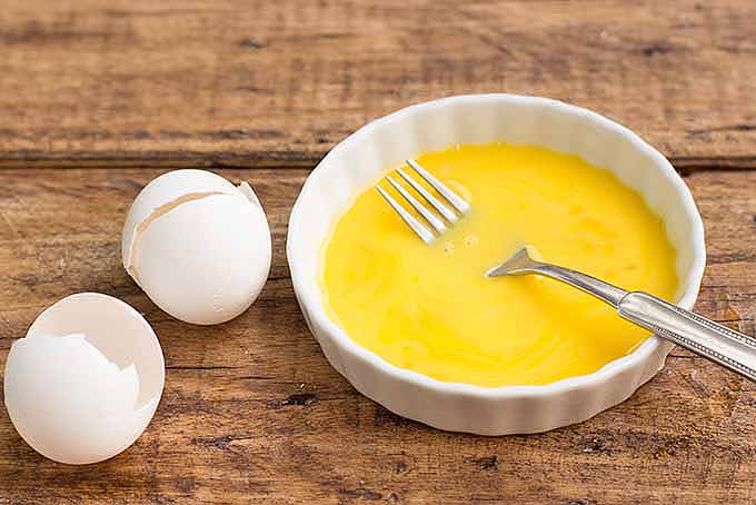 Separate egg yolks to make mayo at home. | Foodal.com