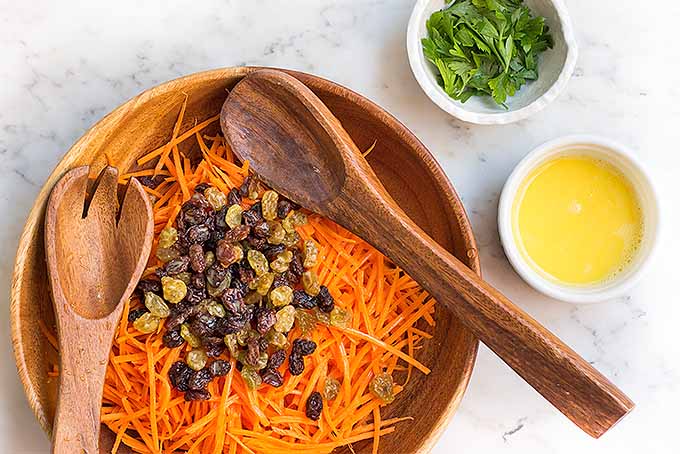 Toss julienned carrots and raisins with homemade lemon aioli to make this quick weeknight side dish. | Foodal.com