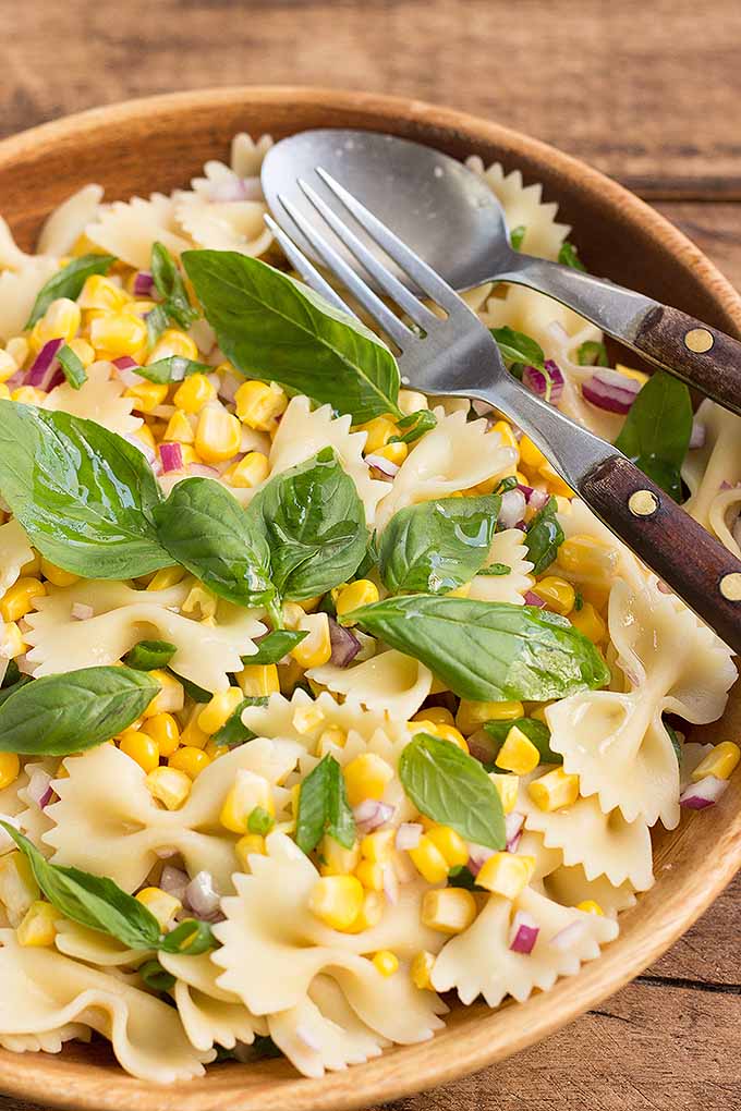 Fresh corn pasta salad is a tasty side dish to serve at your next picnic or cookout. We share our recipe: https://foodal.com/recipes/sides/fresh-corn-pasta-salad/