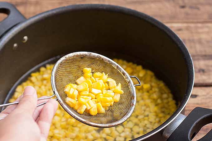 Cooking fresh corn kernels for a corn pasta salad. | Foodal.com