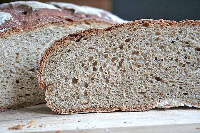 Perfect slices of homemade German dark rye bread. | Foodal.com