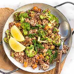 A bright and healthy bowl of lemony chicken quinoa with assorted fresh veggies. | Foodal.com