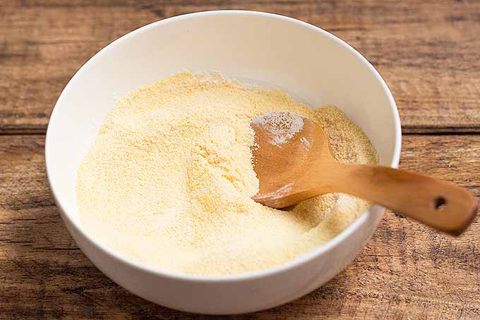Mixing together the dry ingredients for our sweet cornmeal pancakes. | Foodal.com