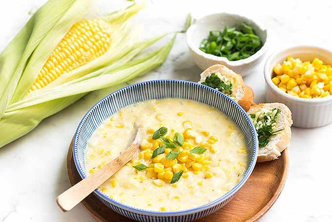 Corn chowder is a complete meal when paired with our fast and easy garlic bread! | Foodal.com