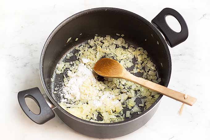 Cooking onions with flour to create a thick base for the best corn chowder. | Foodal.com