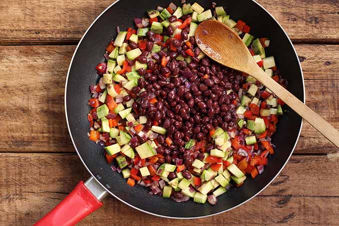 Beans create heartiness in a meatless vegetarian burrito bowl. | Foodal.com