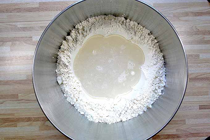 Adding yeast and water for pain paillasse. | Foodal.com