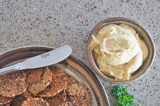 Get your complete proteins with whole grain crackers and hummus. | Foodal.com