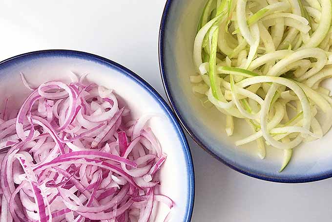 Spiralized red onions and green apples. | Foodal.com